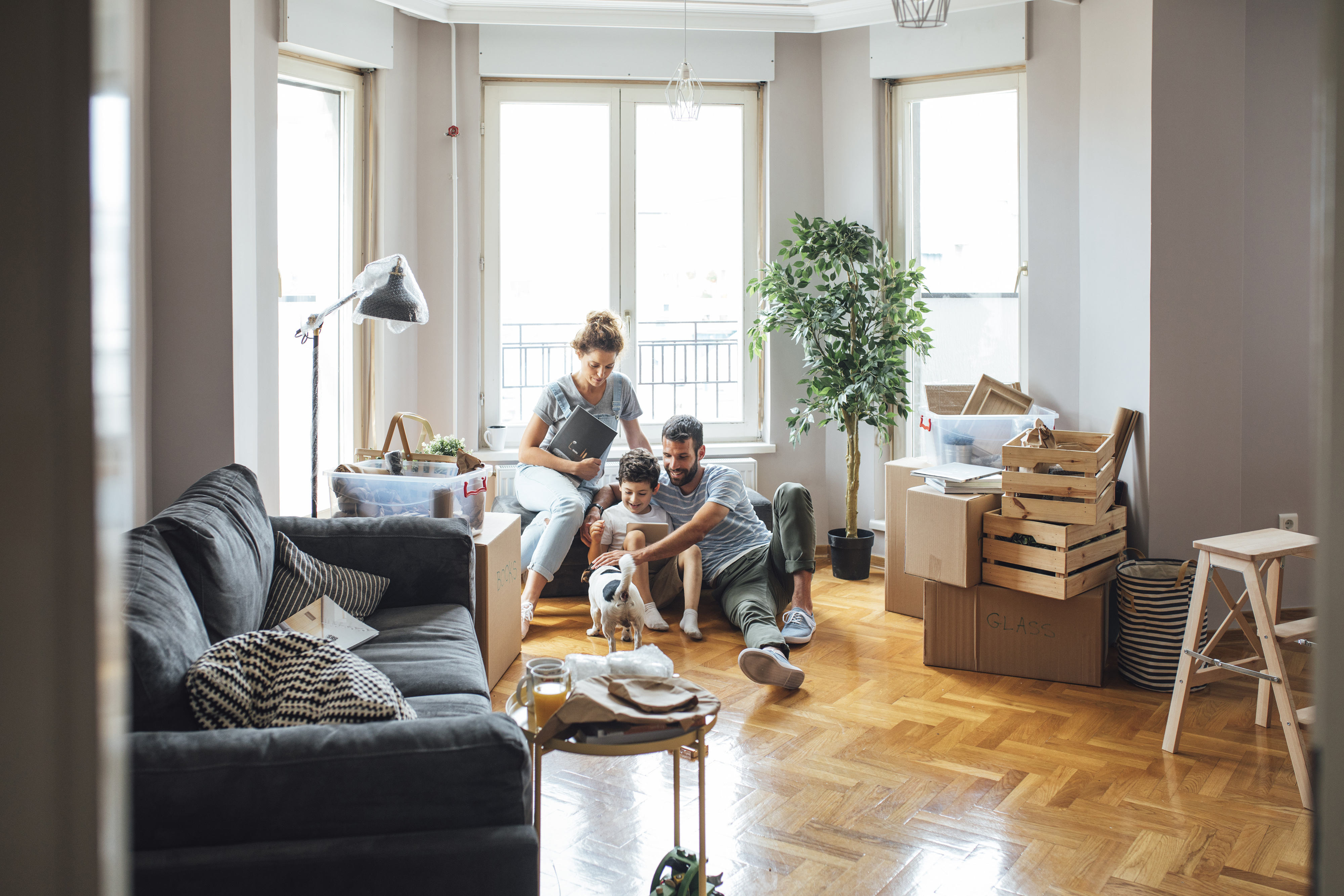 family-in-living-roomt-on-tablet